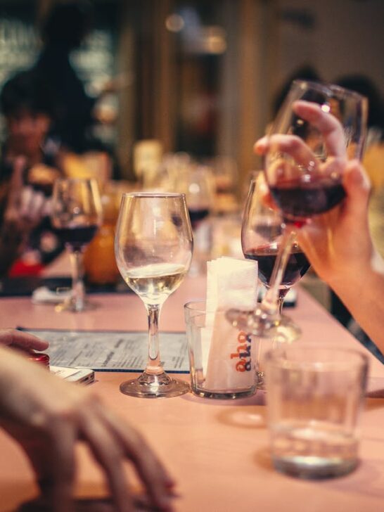 Friends enjoying a relaxed evening together at a restaurant, demonstrating how social awareness helps build stronger relationships and meaningful conversations.