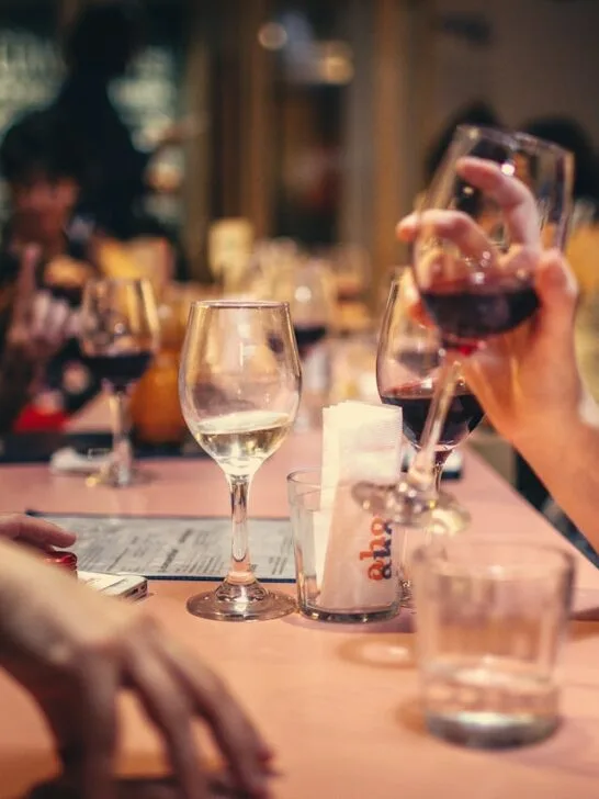 Friends enjoying a relaxed evening together at a restaurant, demonstrating how social awareness helps build stronger relationships and meaningful conversations.