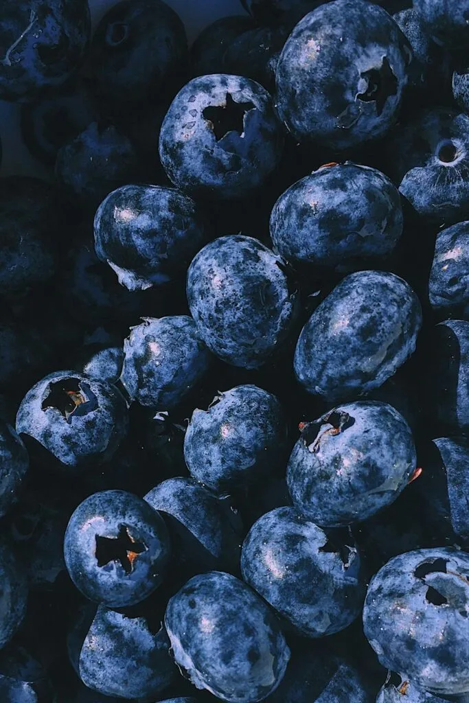 Close-up of fresh blueberries with deep blue tones, highlighting antioxidant-rich fruit often used for natural detox support.