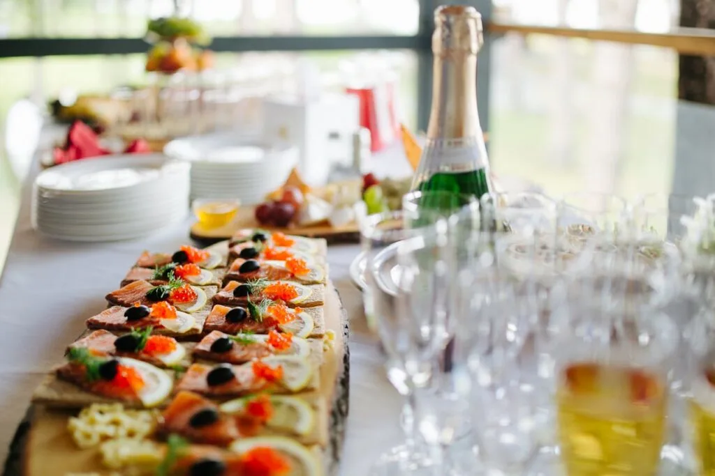 On-site catered food and beverage setup with plated appetizers and drinks arranged for staff service in a remote location