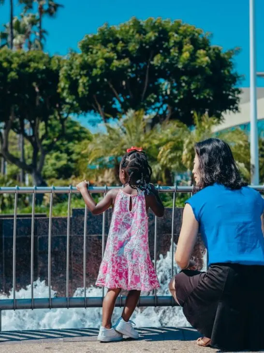 A foster carer spending quiet one-on-one time with a child outdoors, showing trust, reassurance, and everyday connection.