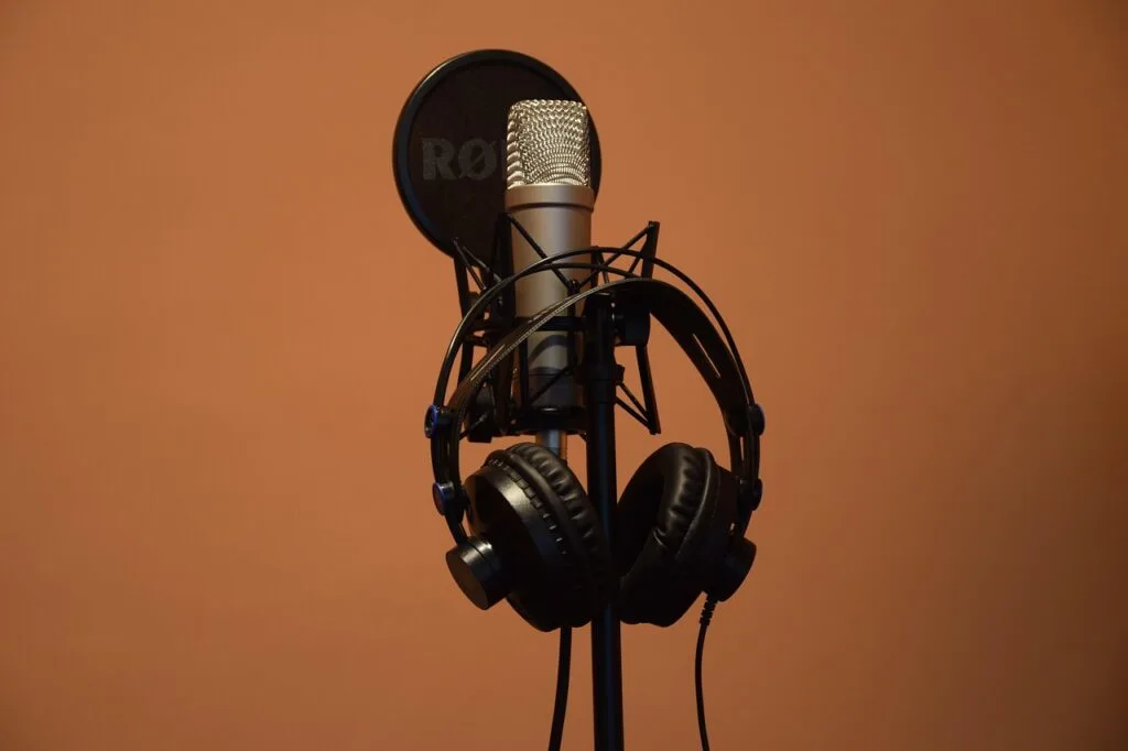 Studio microphone with headphones set up for recording calls or managing professional communication systems.