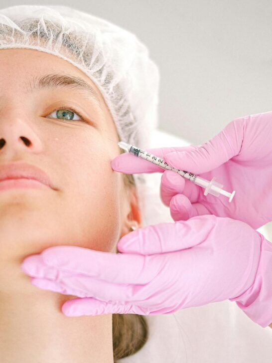 Medical professional administering a facial injection during treatment, illustrating what to know before getting Botox for safe cosmetic care.