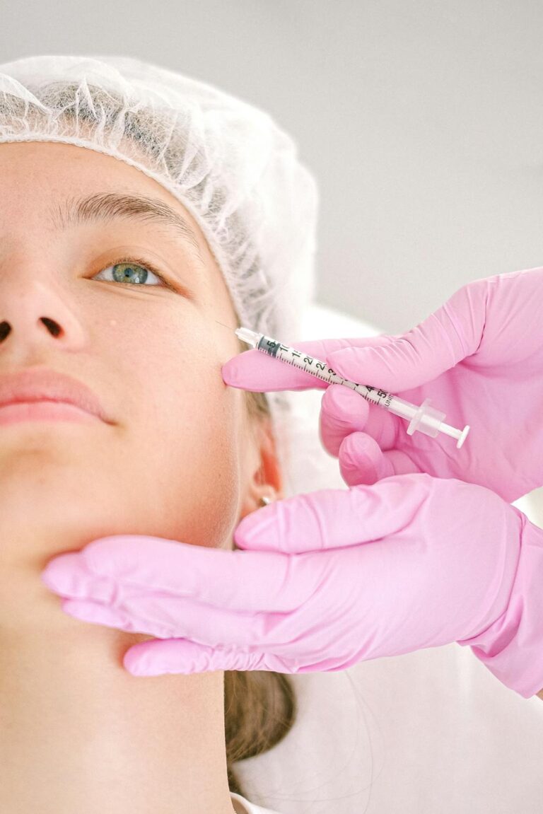 Medical professional administering a facial injection during treatment, illustrating what to know before getting Botox for safe cosmetic care.