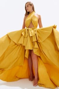 branding lessons from luxury brands shown through elegant couture gown with dramatic flowing fabric and high-end design details