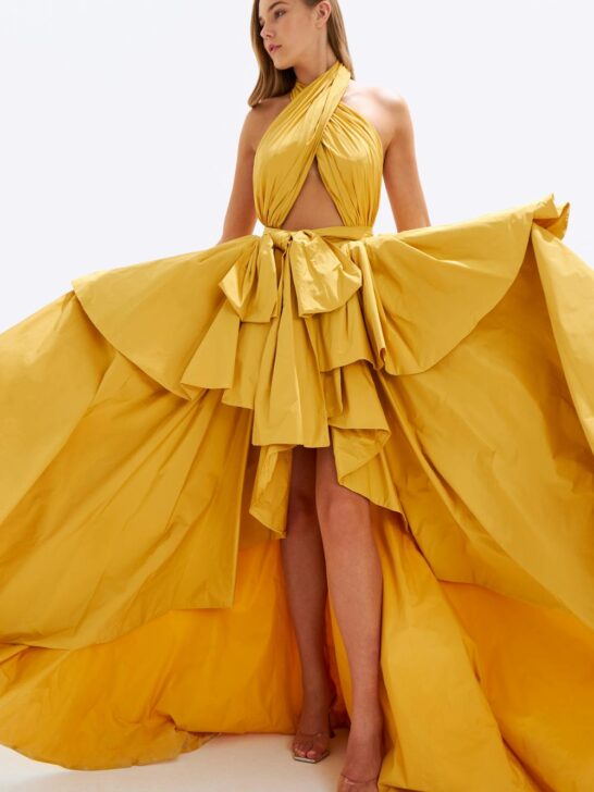 branding lessons from luxury brands shown through elegant couture gown with dramatic flowing fabric and high-end design details