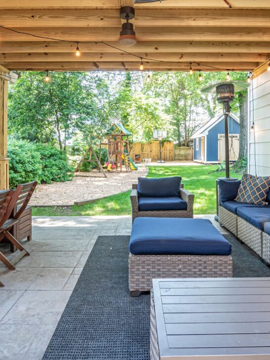 family-friendly backyard design with covered patio seating, outdoor dining area, and kids play space in backyard