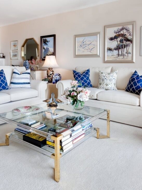 how to make your living room feel warm and inviting with soft neutral seating, plants, and cozy lighting accents