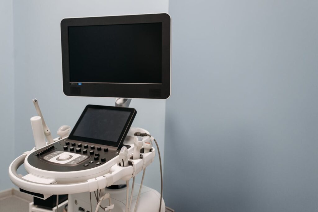 Ultrasound machine in a medical exam room used for diagnostic imaging during routine health screenings