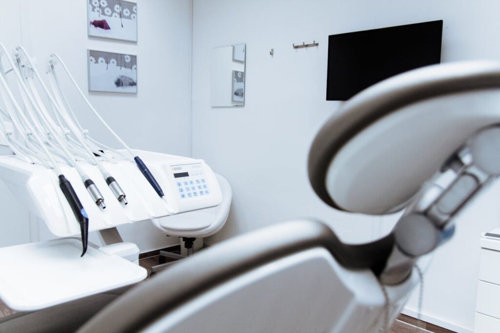 Modern restorative dentistry innovations shown in a clean dental clinic with advanced treatment chair and precision tools.