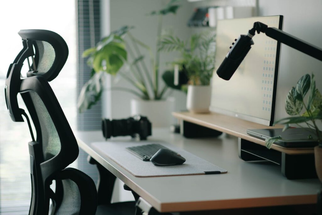 Desk makeover ideas featuring clean workspace with ergonomic chair, monitor, and minimal setup