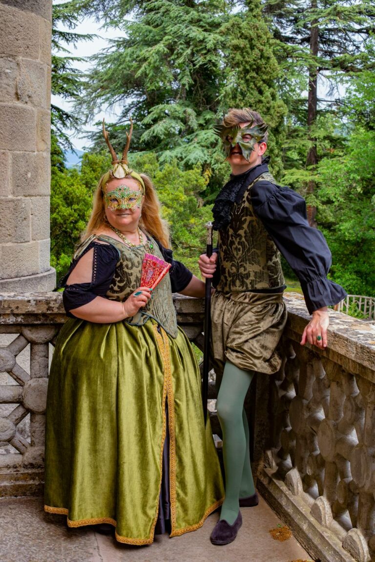 Renaissance party ideas with guests wearing medieval costumes and masks at a themed outdoor gathering