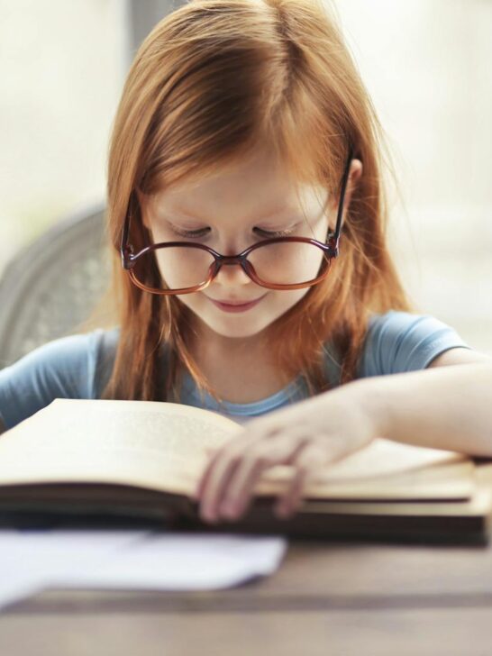 child reading book close-up