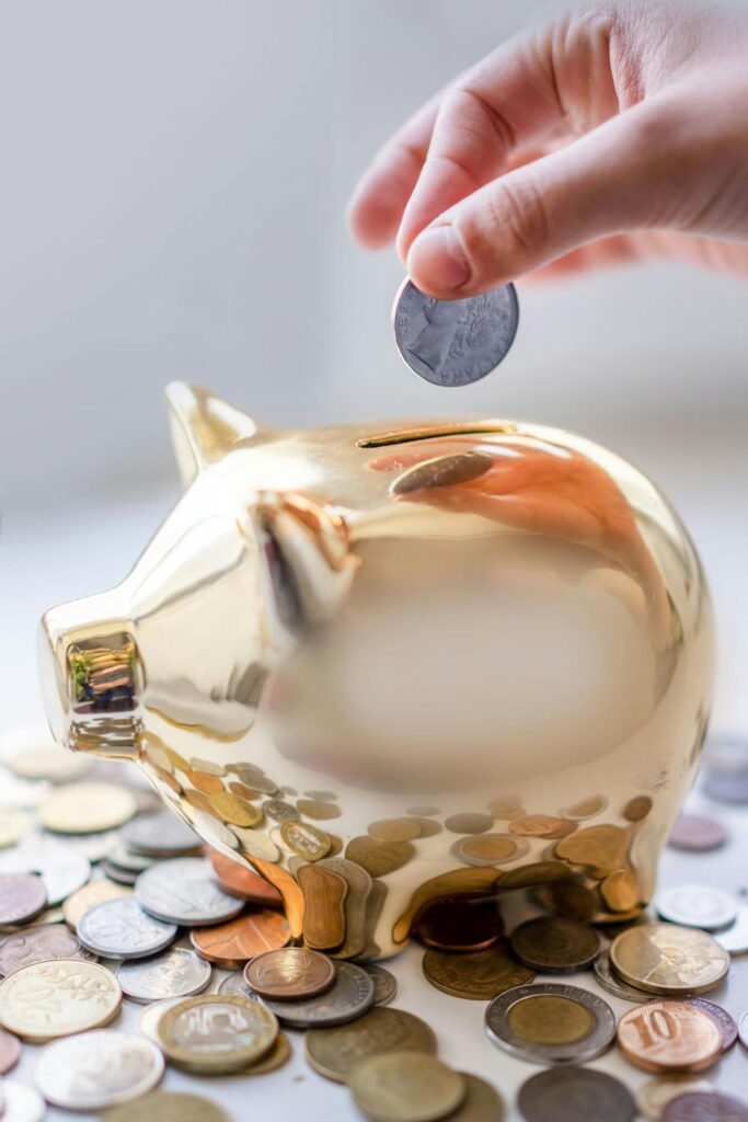 Financial projection tools concept showing savings growth with coins being added to a piggy bank