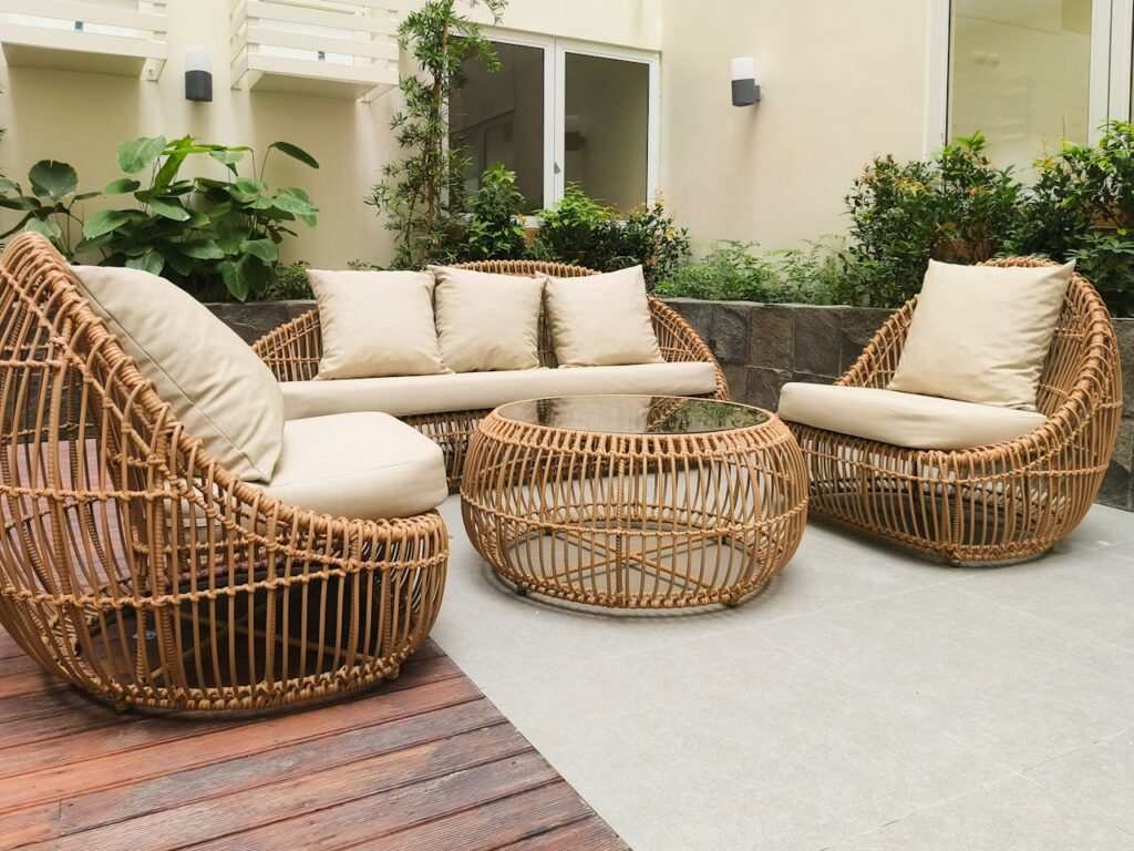Outdoor patio seating area with wicker furniture, ideal space for how to keep wasps away during summer gatherings