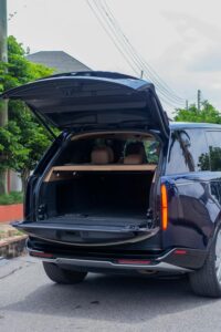 Person using smartphone map for planning neighborhood errands while sitting in car