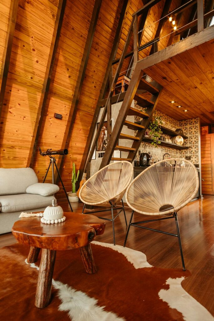 modern living room with wood accents, sloped wood ceiling, and rustic wood furniture design