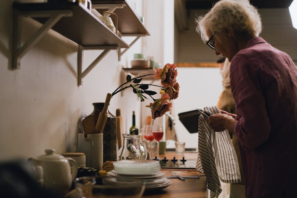 Senior woman completing daily tasks at home showing independent living tips for seniors