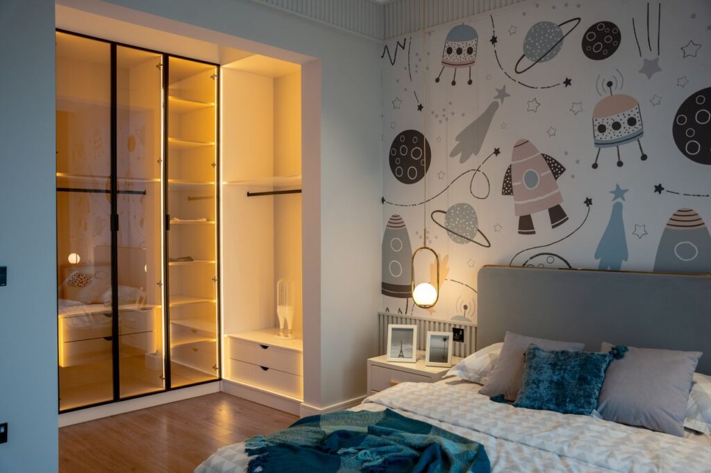Double bed for child's bedroom featuring a modern space-themed design, built-in wardrobe storage, and a layout that maximizes comfort in a compact room.