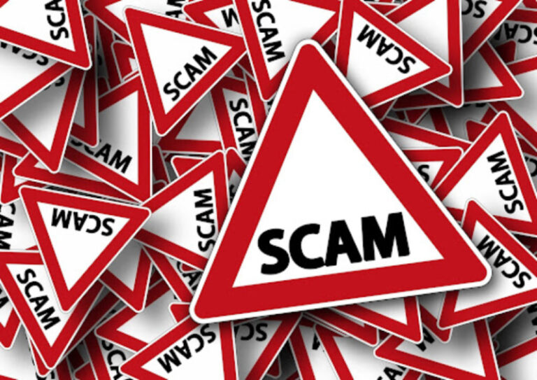 Warning signs labeled "SCAM" illustrating how to spot a charity scam before making a donation