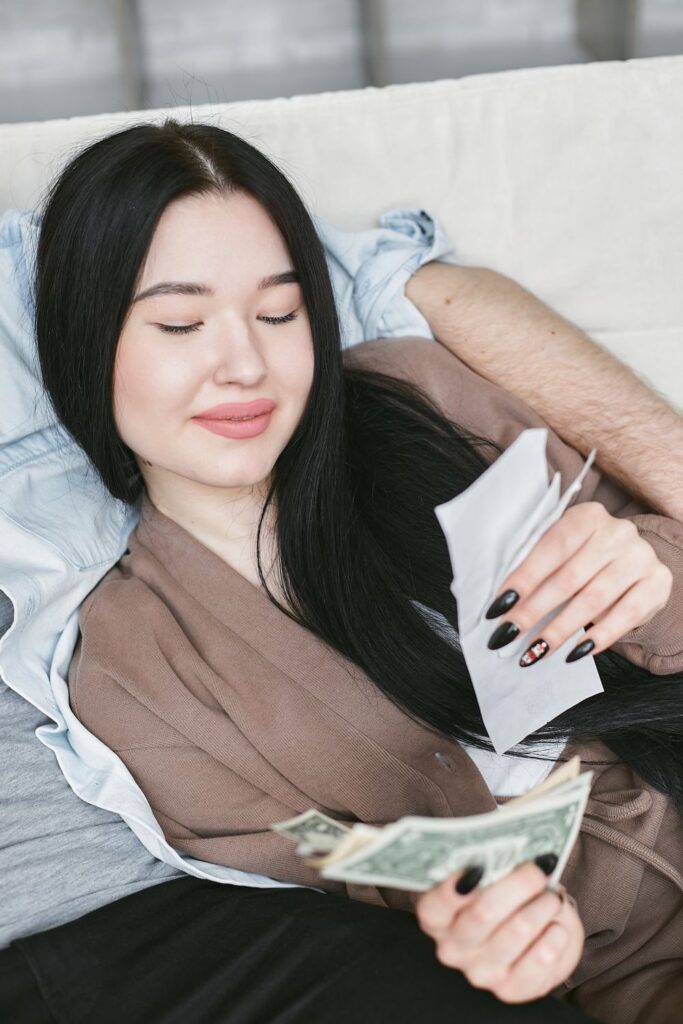 Woman reviewing earnings from side hustles and money-making apps at home