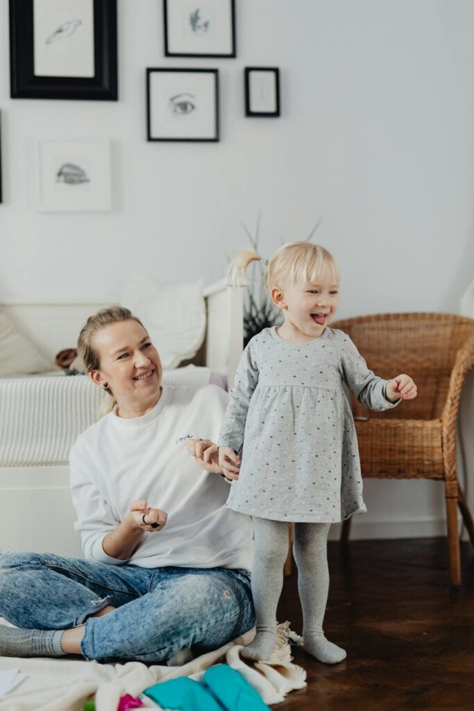 Mother and young child enjoying quality time together at home while building healthy family habits and routines.