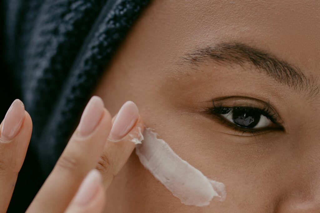 Close-up of a person applying facial moisturizer, highlighting the long-term firming cream benefits for smoother, healthier-looking skin