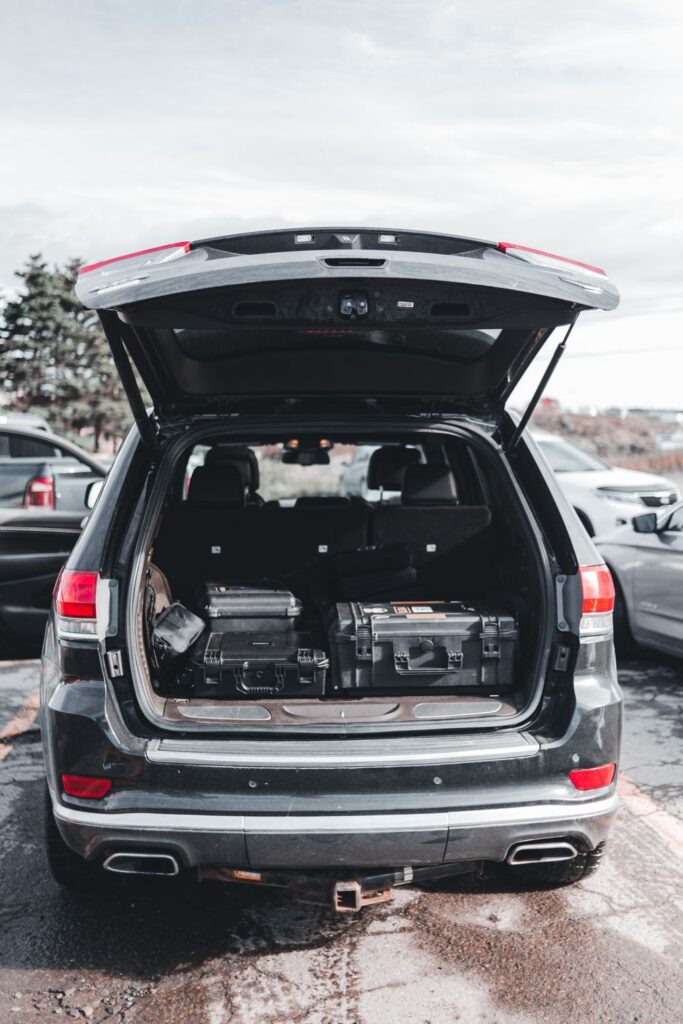 pen cargo area of a midsize SUV showing spacious storage with luggage and equipment, highlighting generous cargo capacity for travel and everyday use.
