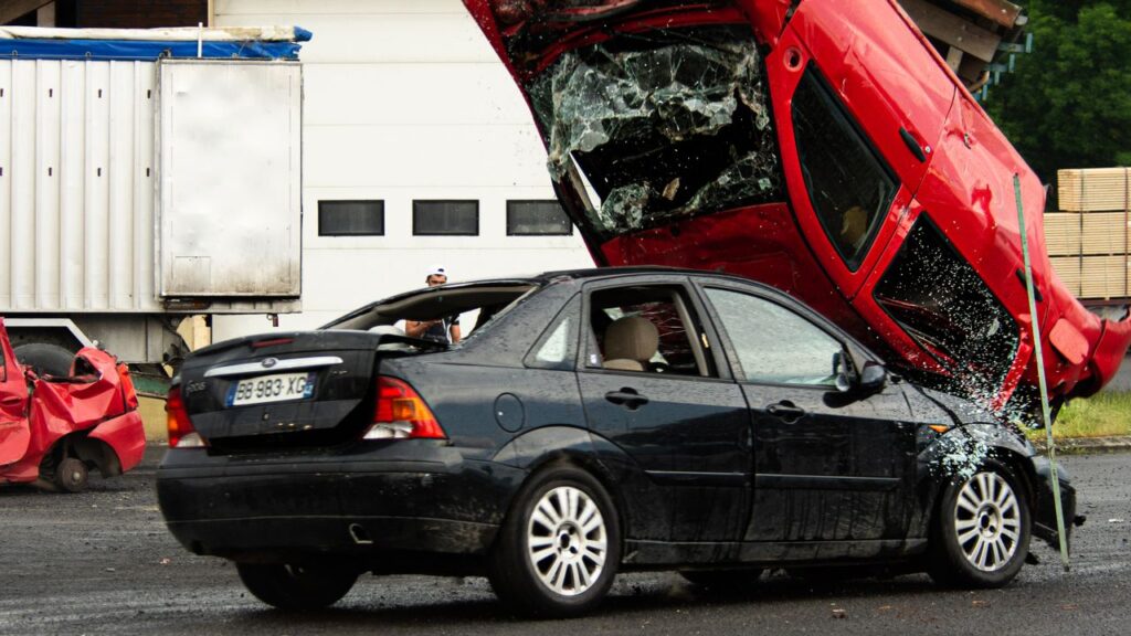 Two heavily damaged vehicles after a serious collision, illustrating how crash injuries may not appear immediately.