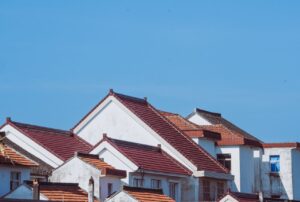 Modern homes with durable red tile roofs designed to withstand harsh weather and provide long-lasting protection.