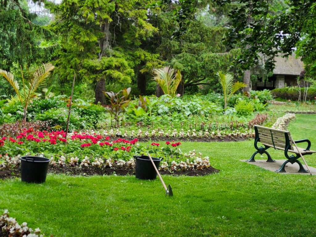 Smart water management in a landscaped backyard featuring healthy flower beds, lush greenery, and efficient outdoor gardening practices.