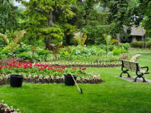 Smart water management in a landscaped backyard featuring healthy flower beds, lush greenery, and efficient outdoor gardening practices.