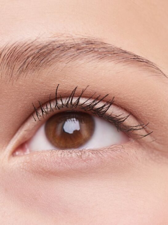 Close-up of a healthy eye and naturally full eyebrow showing well-defined brow hairs and natural growth.