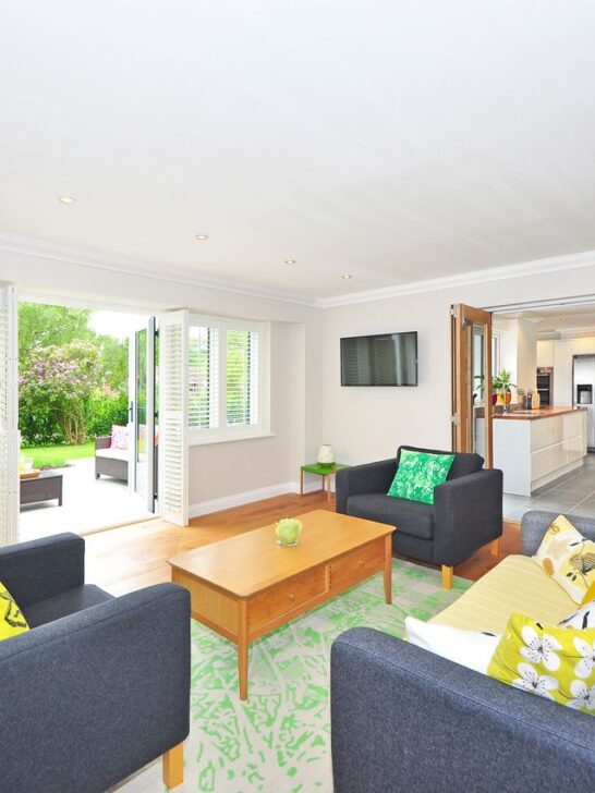 Bright open-concept space with colorful seating and furniture arranged to refresh a living room