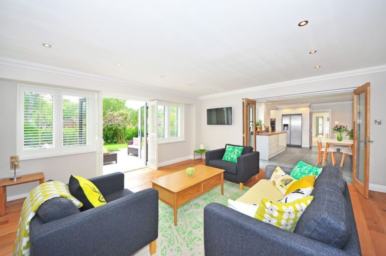 Bright open-concept space with colorful seating and furniture arranged to refresh a living room