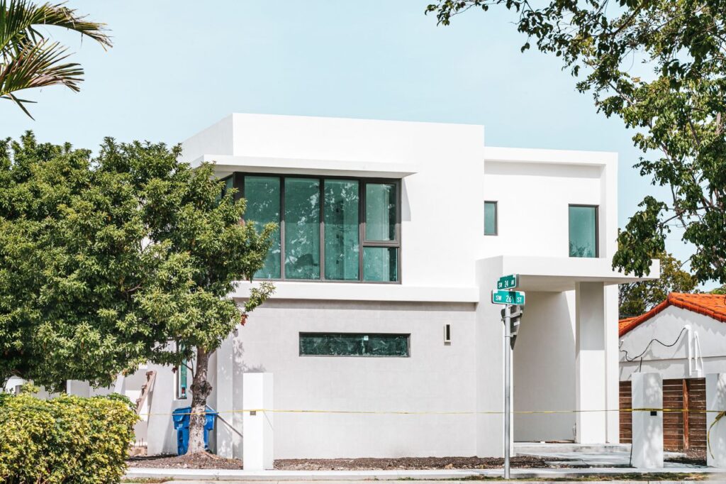 Modern home featuring storm-resistant windows designed to improve protection against hurricanes and high winds.
