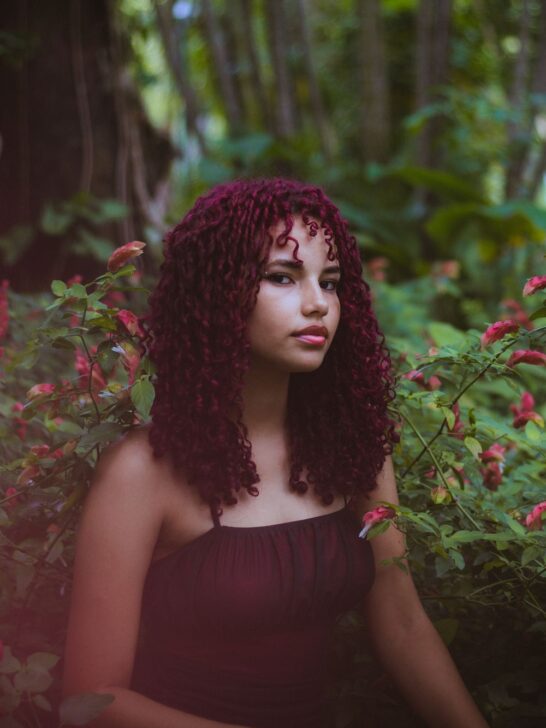 Woman with long curly DIY burgundy hair
