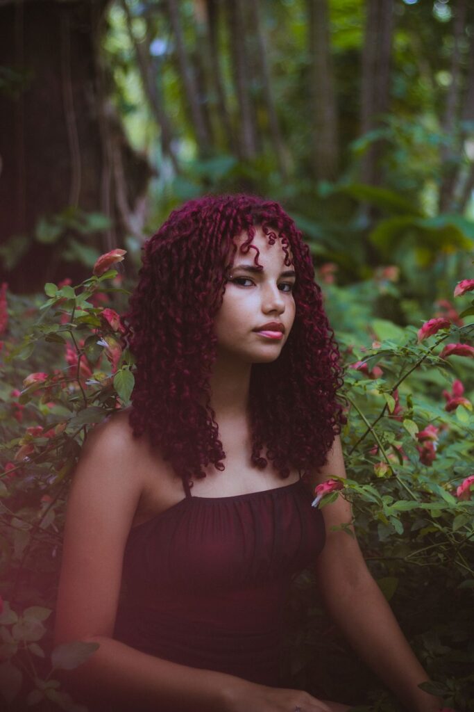 Woman with long curly DIY burgundy hair