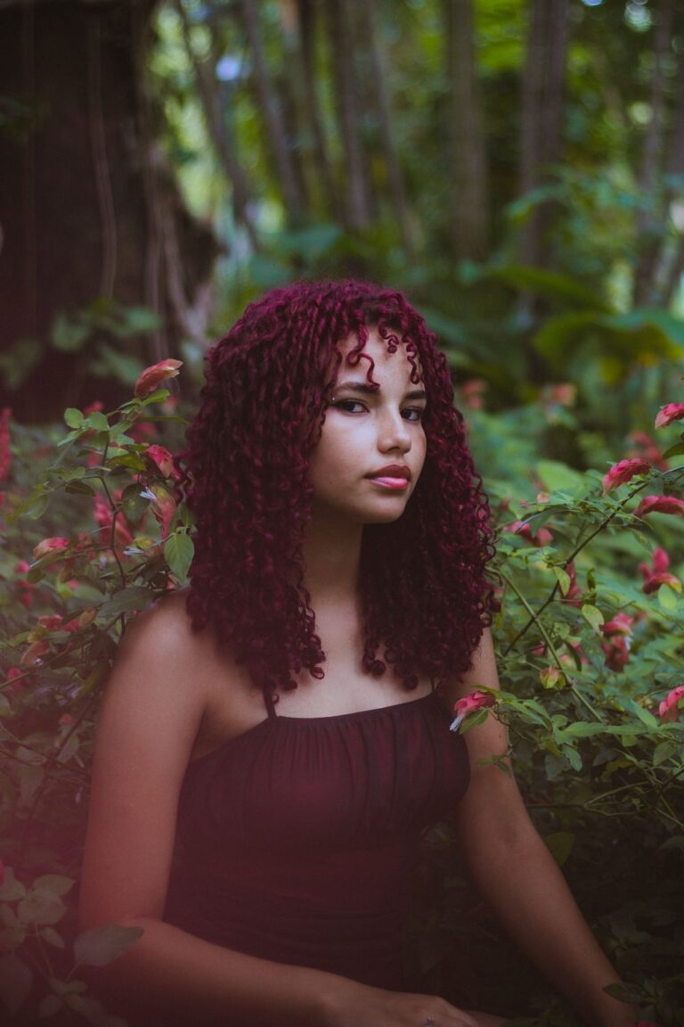 Woman with long curly DIY burgundy hair
