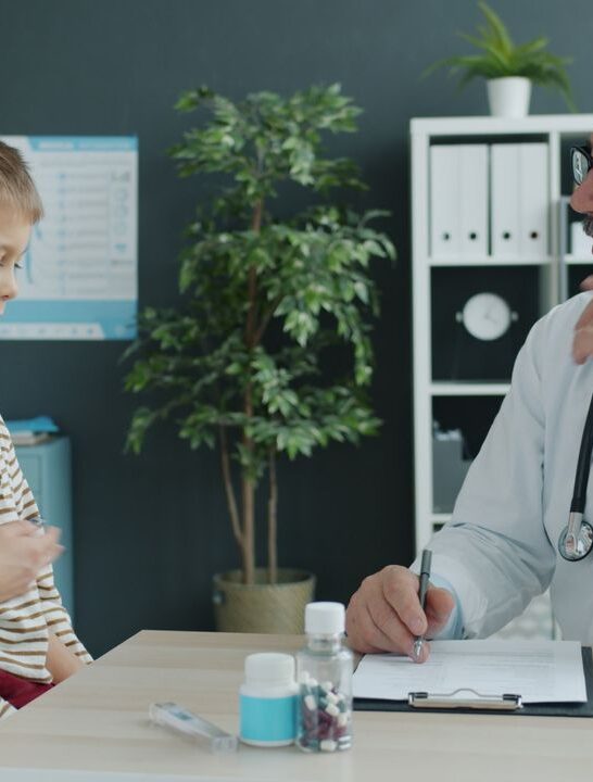 Effective communication in healthcare between a doctor, parent, and child during a medical appointment