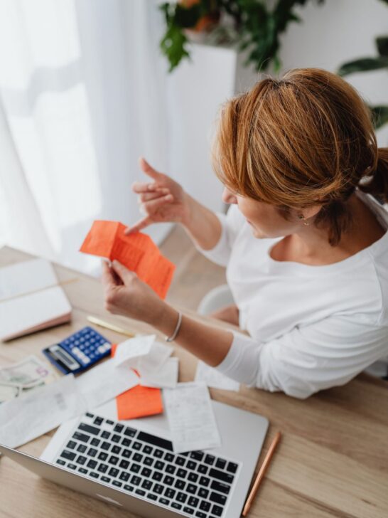 Woman reviewing expenses for financial planning for business owners