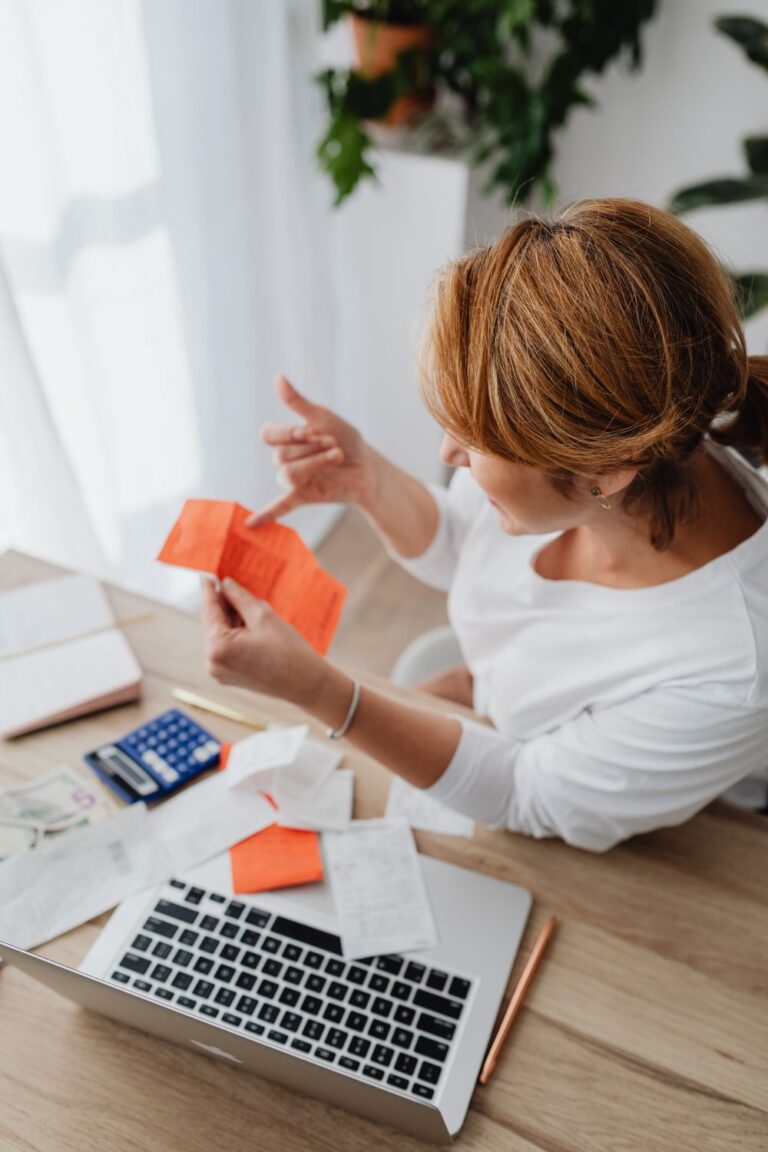 Woman reviewing expenses for financial planning for business owners